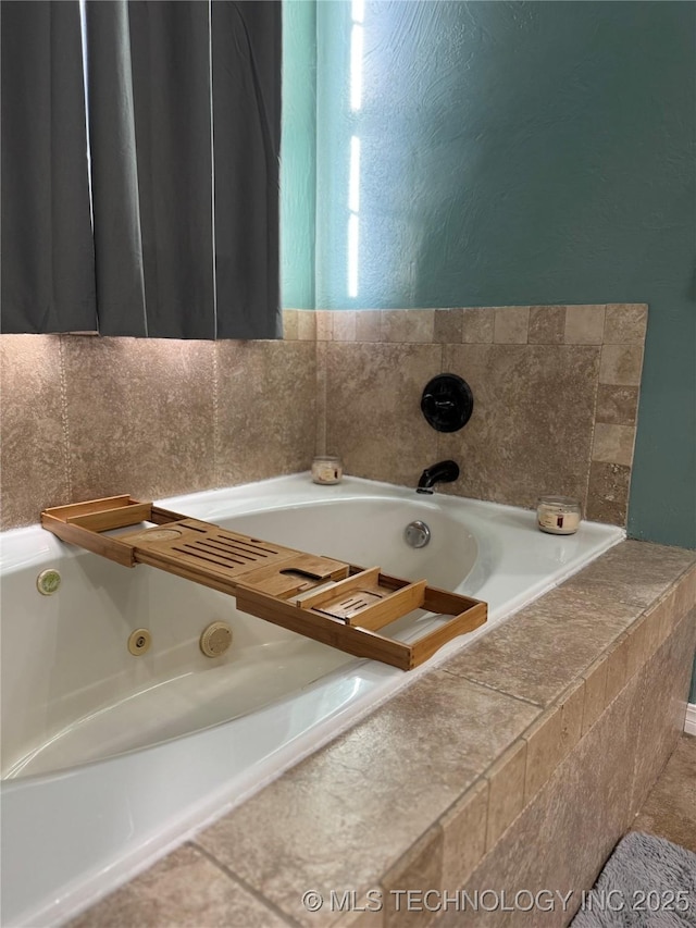 bathroom with tiled bath