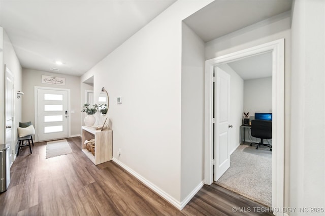 entryway with dark hardwood / wood-style floors