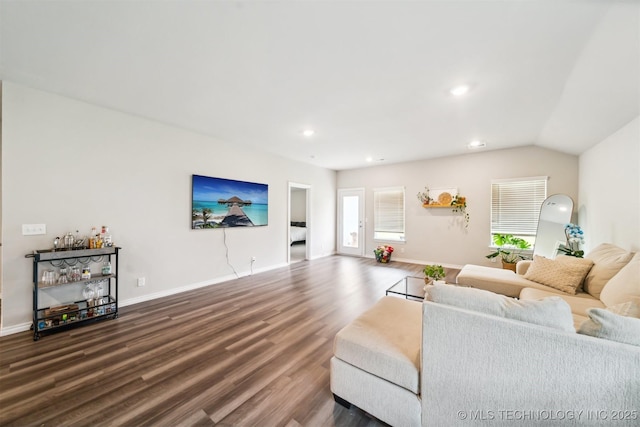 living room with dark hardwood / wood-style flooring and vaulted ceiling