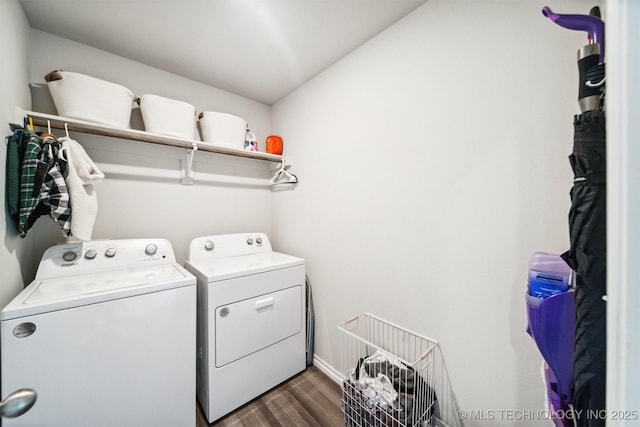 clothes washing area featuring washing machine and dryer and dark wood-type flooring