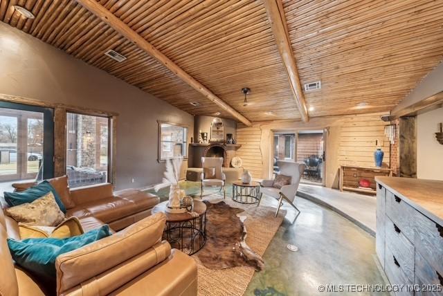 living room featuring lofted ceiling with beams and wood ceiling