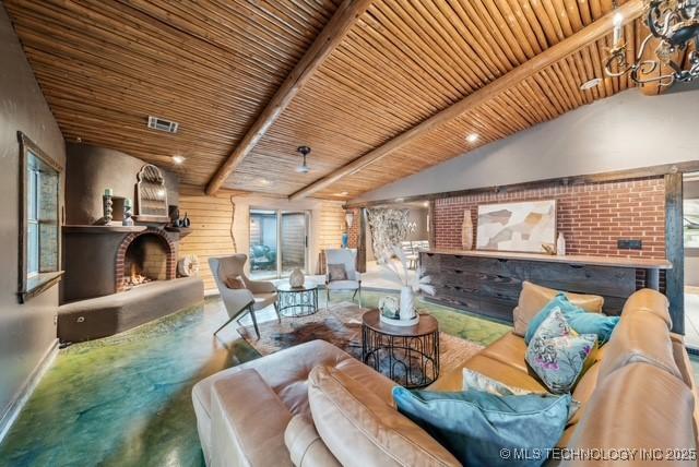 living room featuring vaulted ceiling with beams and wood ceiling