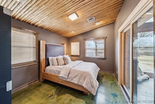 bedroom with wooden ceiling and vaulted ceiling