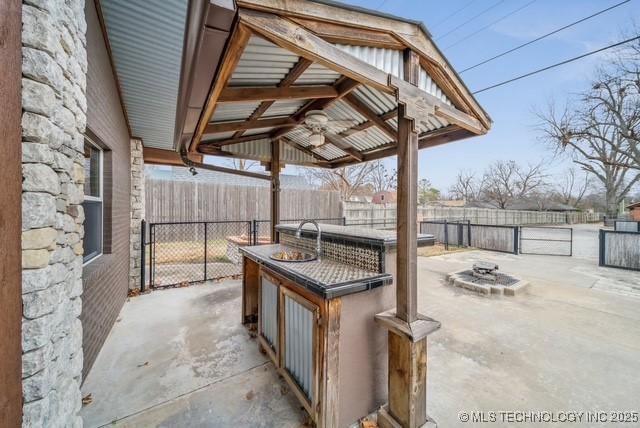 view of patio featuring an outdoor fire pit