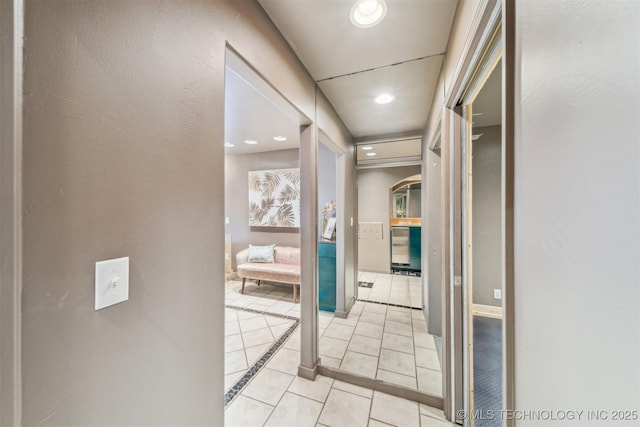 corridor with light tile patterned flooring