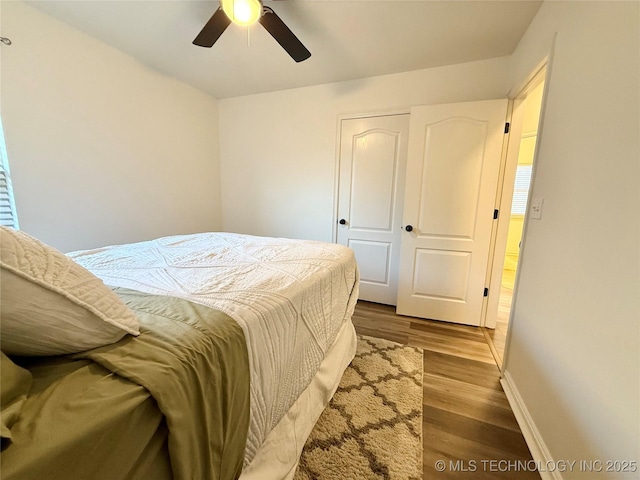 bedroom featuring hardwood / wood-style flooring and ceiling fan