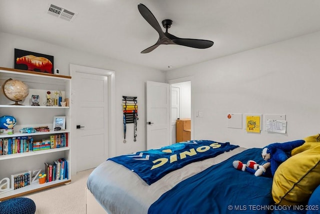 bedroom with carpet, visible vents, and a ceiling fan