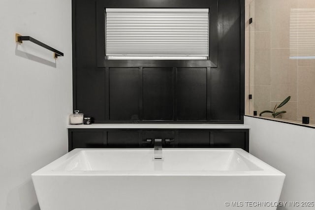 full bath with a soaking tub
