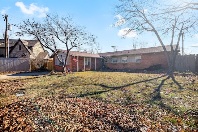 rear view of house with a lawn