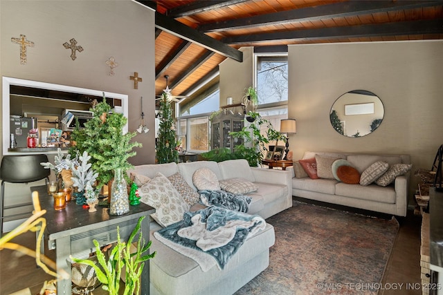 living room featuring vaulted ceiling with beams, ceiling fan, and wooden ceiling