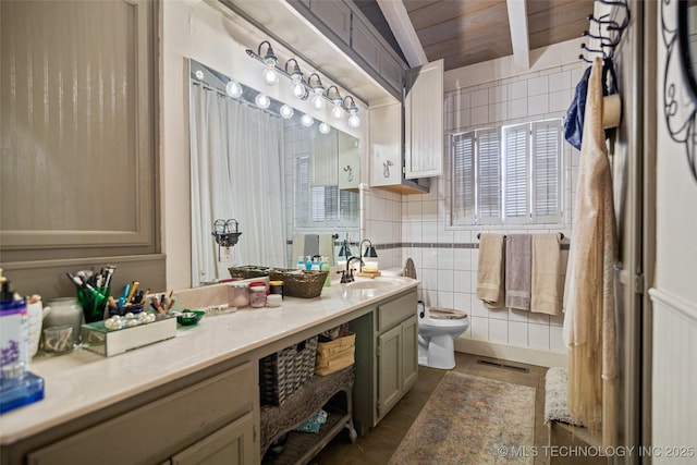 bathroom featuring vanity and toilet