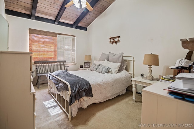 bedroom with vaulted ceiling with beams, ceiling fan, light colored carpet, and wooden ceiling