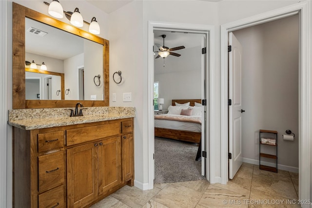 bathroom featuring vanity and ceiling fan