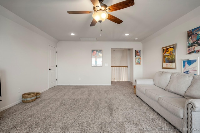 unfurnished living room featuring ceiling fan and carpet