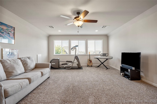 living room featuring carpet flooring and ceiling fan