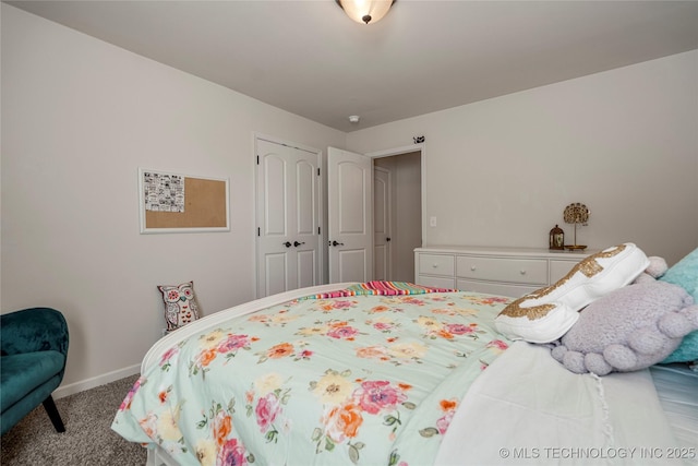 bedroom with light carpet and a closet