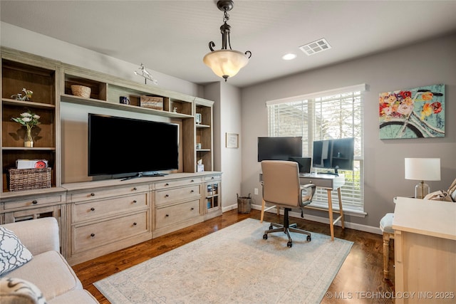 office space with dark hardwood / wood-style floors