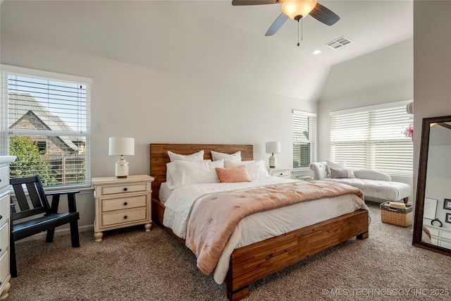 carpeted bedroom with multiple windows, ceiling fan, and lofted ceiling