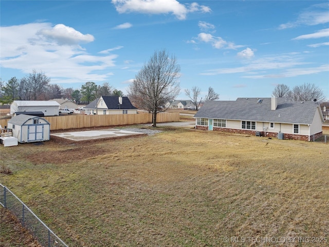 view of yard with a patio and a shed