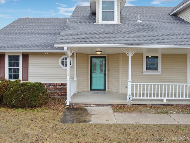 doorway to property featuring covered porch