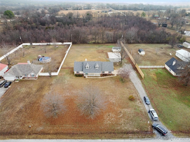 birds eye view of property with a rural view