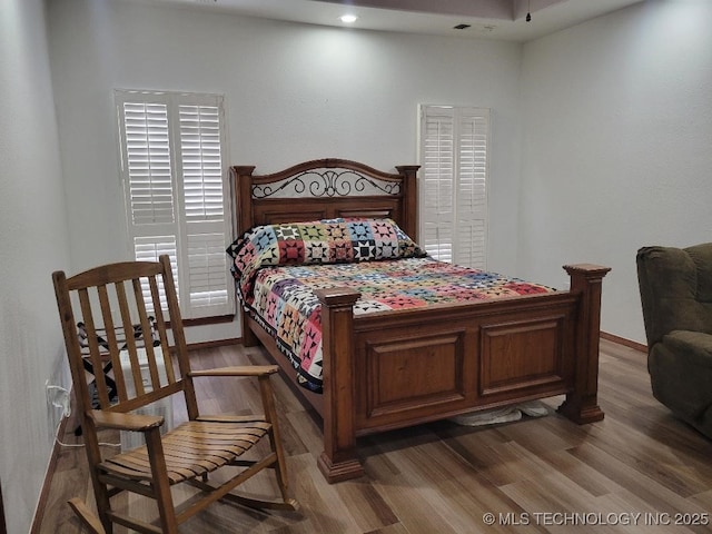 bedroom featuring hardwood / wood-style floors