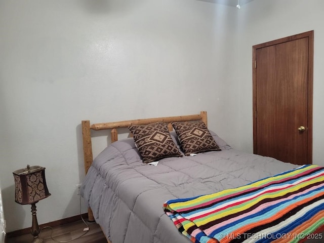 bedroom featuring wood-type flooring