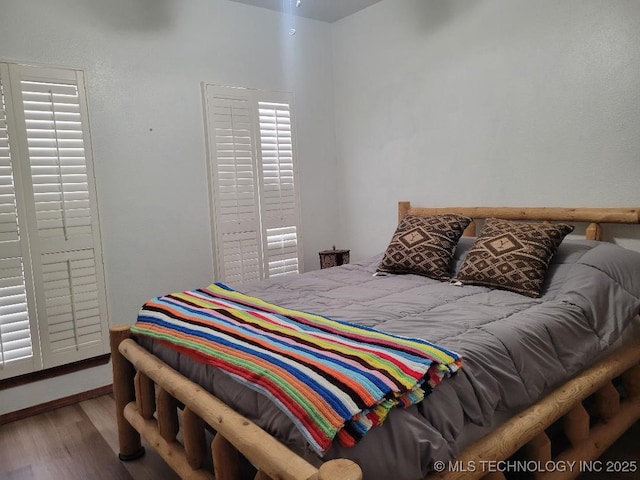 bedroom featuring wood-type flooring