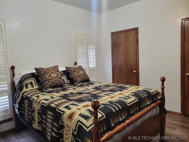 bedroom featuring wood-type flooring