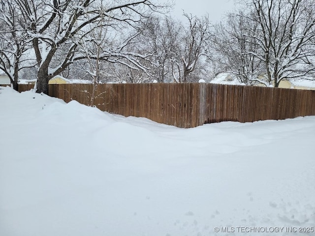 view of yard layered in snow