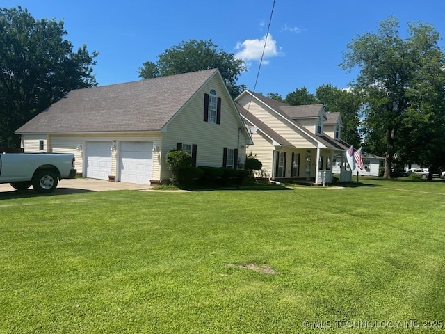 view of side of home with a garage and a yard