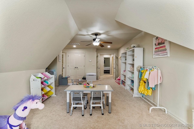 recreation room featuring light carpet, ceiling fan, and lofted ceiling