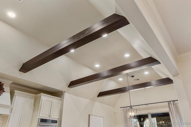 interior details featuring wall oven and a chandelier