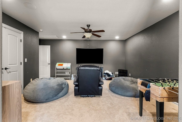 recreation room featuring carpet and ceiling fan