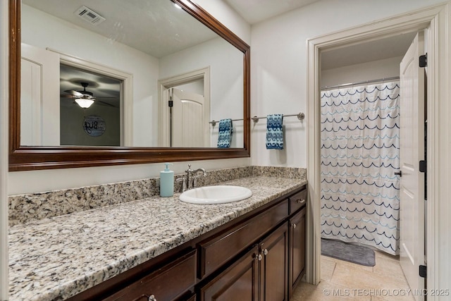 bathroom featuring ceiling fan, tile patterned flooring, vanity, and a shower with shower curtain