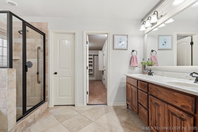 bathroom featuring vanity and a shower with door