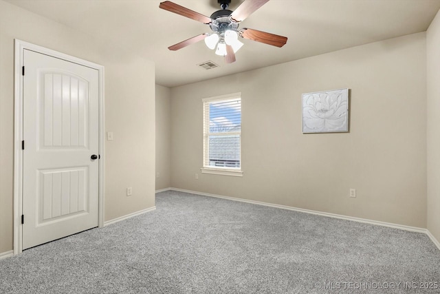 empty room featuring carpet flooring and ceiling fan