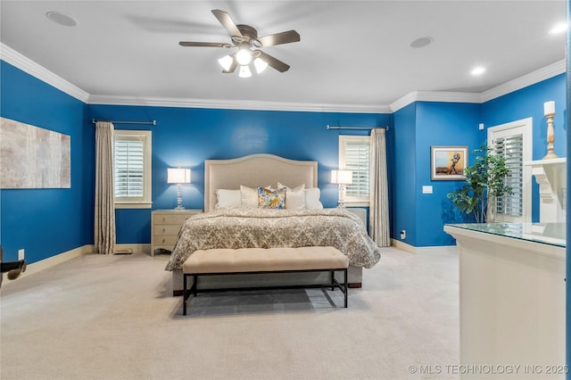 carpeted bedroom with multiple windows, ceiling fan, and ornamental molding