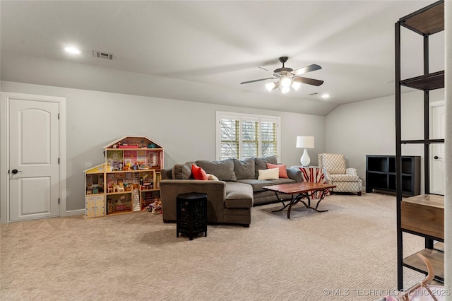 living room with ceiling fan, light colored carpet, and lofted ceiling