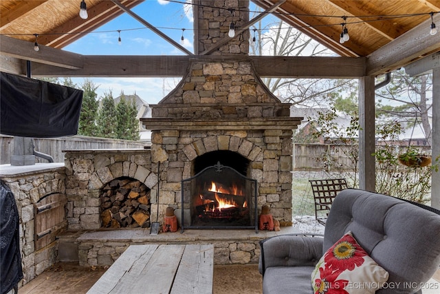 view of patio / terrace featuring an outdoor stone fireplace