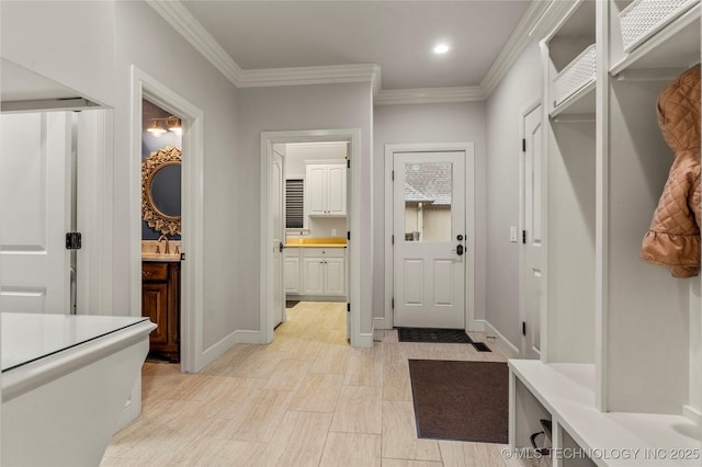 mudroom featuring crown molding