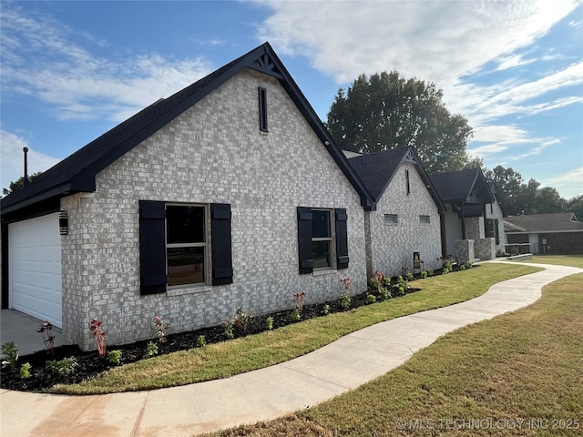 view of property exterior with a lawn and a garage