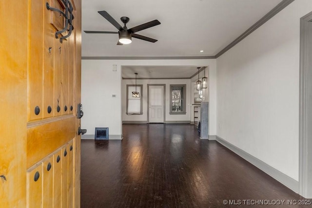 interior space with ceiling fan, dark hardwood / wood-style floors, and crown molding