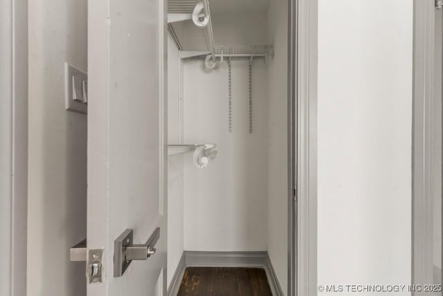 bathroom with hardwood / wood-style flooring