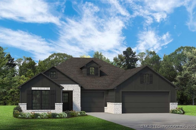 view of front of house with a front yard and a garage