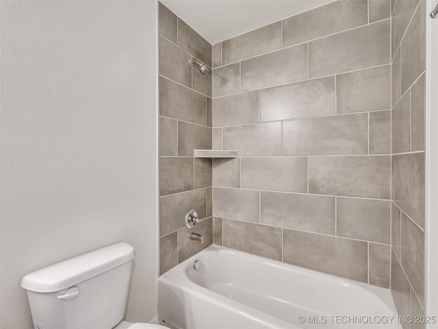 bathroom with toilet and shower / bathtub combination