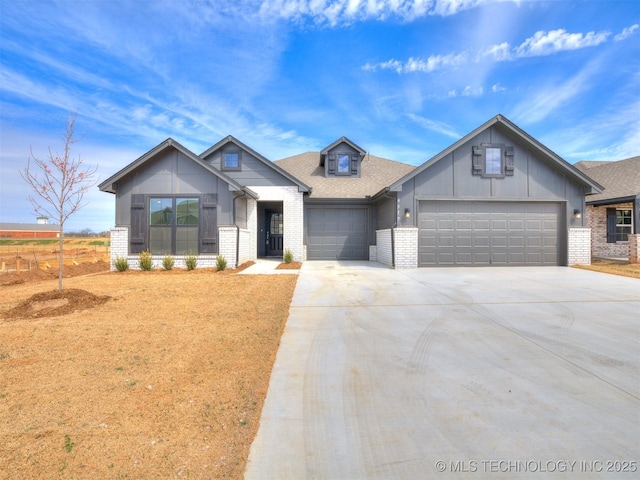 modern farmhouse style home with driveway, board and batten siding, a shingled roof, an attached garage, and brick siding
