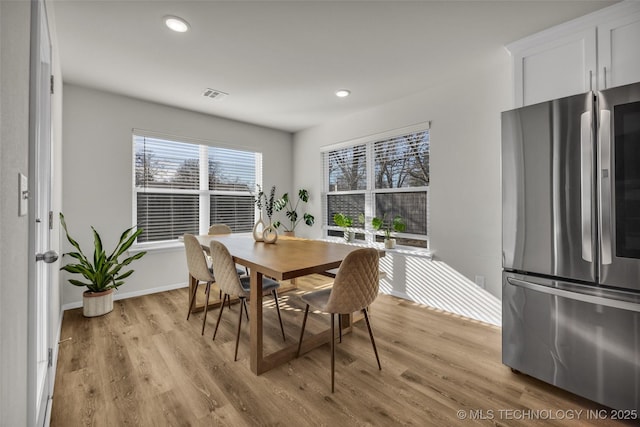 dining space featuring light hardwood / wood-style floors