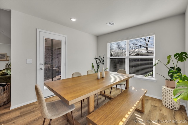 dining space with light wood-type flooring