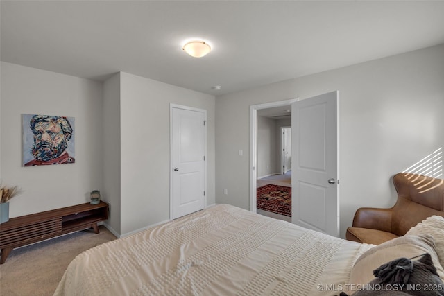 bedroom featuring light carpet